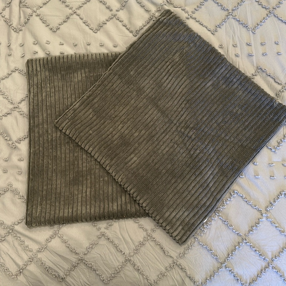 NWOT pair of medium to dark gray pillow covers.